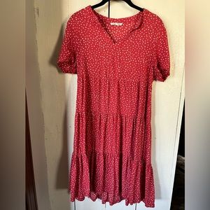 Cute spring dress. Nice cover up, or pair with sandals to dress up.